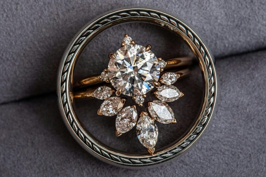 Close-up of a stunning diamond ring with a floral brooch design, showcasing luxury jewelry.